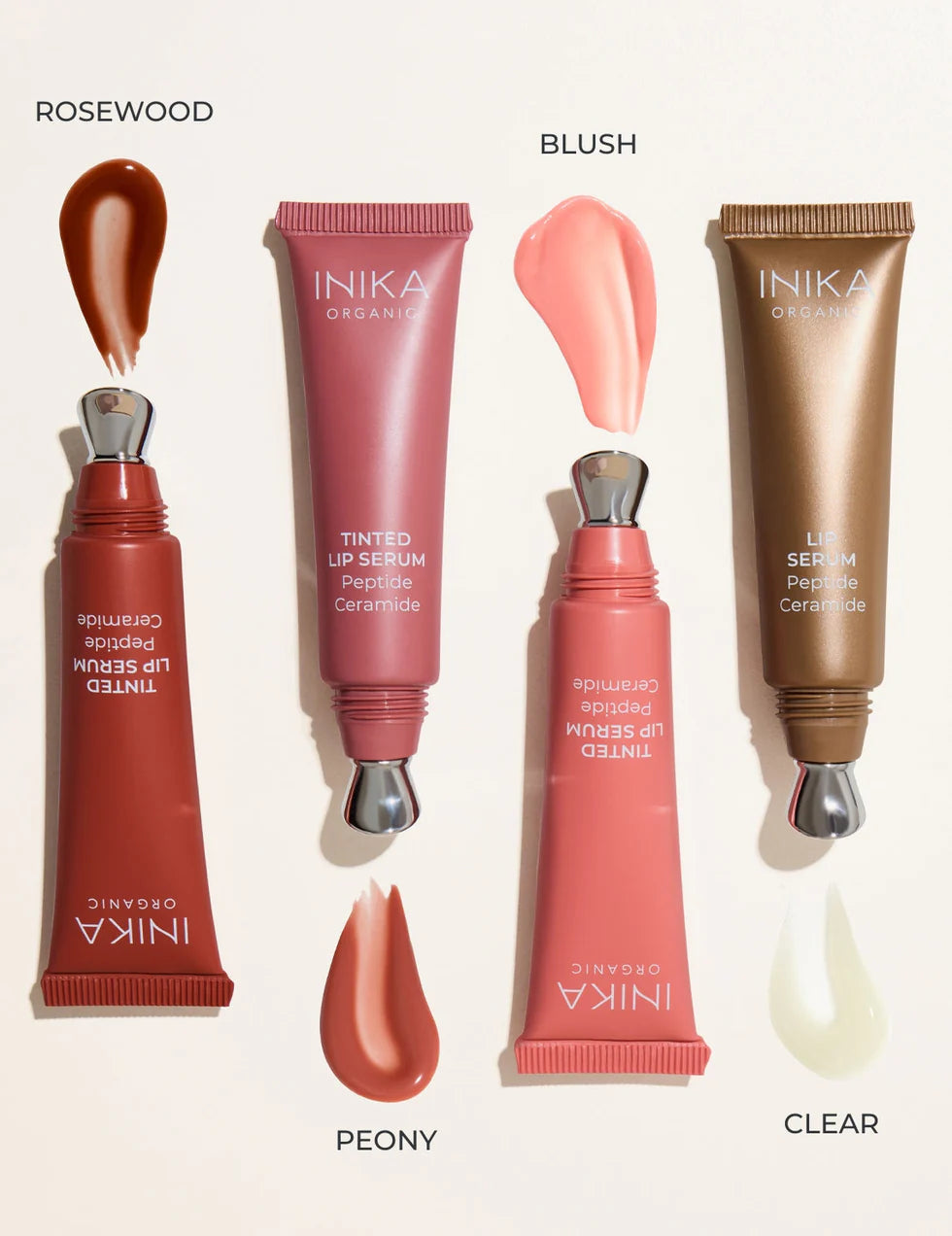 Verschillende kleuren en swatches van de INIKA Organic Tinted Lip serums met Peptiden en Ceramiden. 